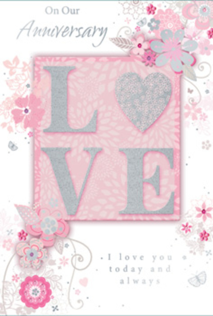 The anniversary card in view has the gentle, welcoming atmosphere of stepping into a sunlit Westcombe Park living room where love is part of the everyday. Dominating the centre is the word LOVE, printed in generous, uppercase letters that are raised from the surface, creating a pleasing, tactile relief. The letters are coated with a frosted glitter finish that catches every hint of light, much like dew sparkling on the grass in nearby Greenwich Park on an early morning walk. Around this central motif, the card is framed with a soft blush background that gently fades to paler tones, suggestive of sheer fabric or delicate petals layered one over another. Along the borders, wispy hand-drawn blooms drift in loose, graceful arrangements, their petals tinted with pale pink, lilac, and creamy white. Fine filigree flourishes and slender leaves weave between the flowers, with the occasional almost-hidden butterfly adding an extra note of quiet joy and movement. These details evoke the thoughtful artistry of a florist planning a romantic bouquet, each line and curve considered, much like placing each stem just so. Towards the lower half of the card, the words I love you today and always appear in a refined, understated script, resting calmly beneath the glittered LOVE. The message feels intimate and sincere, like something whispered over coffee on a quiet anniversary morning. The entire design suggests a hand-tied bouquet translated into paper-light, fragrant in the imagination, and full of gratitude. It mirrors the gentle, enduring affection of couples who celebrate milestones at home in Westcombe Park, perhaps after picking up flowers from a favourite local shop.